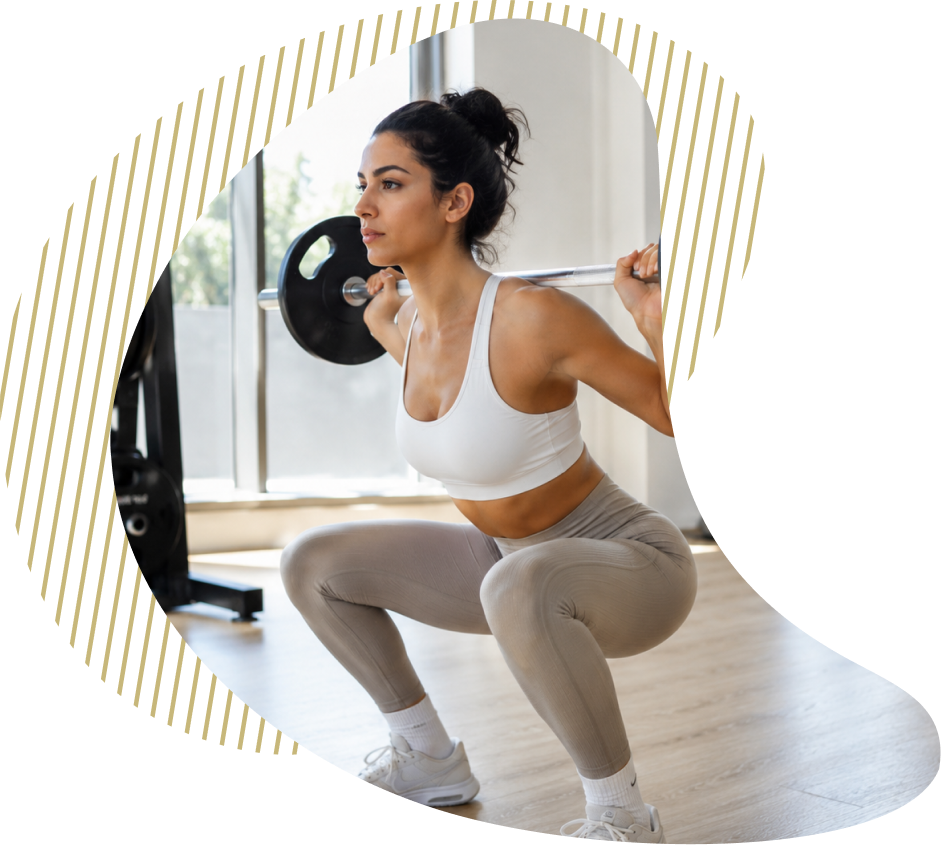 A member working through a barbell squat